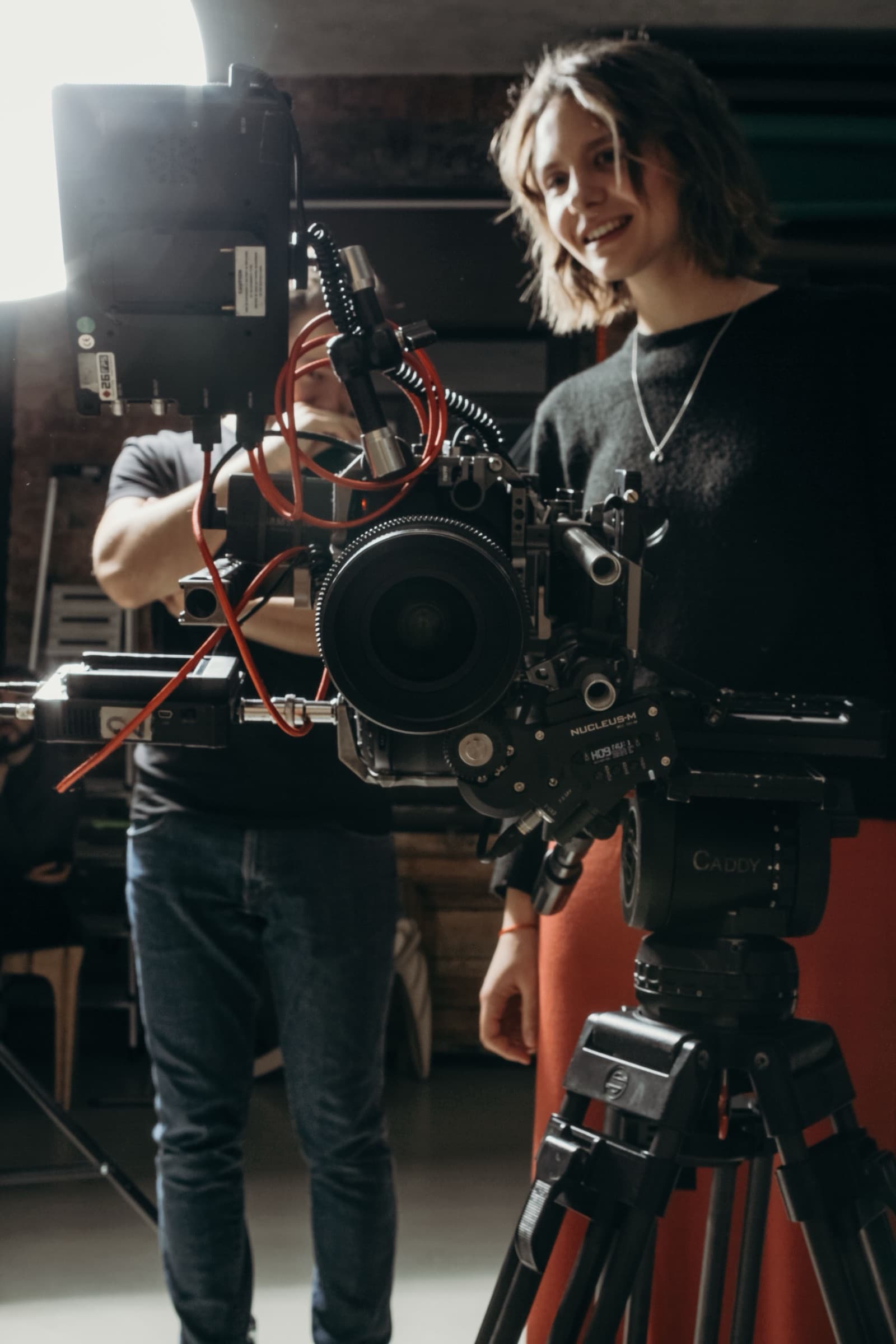 Video production crew filming with a professional camera rig