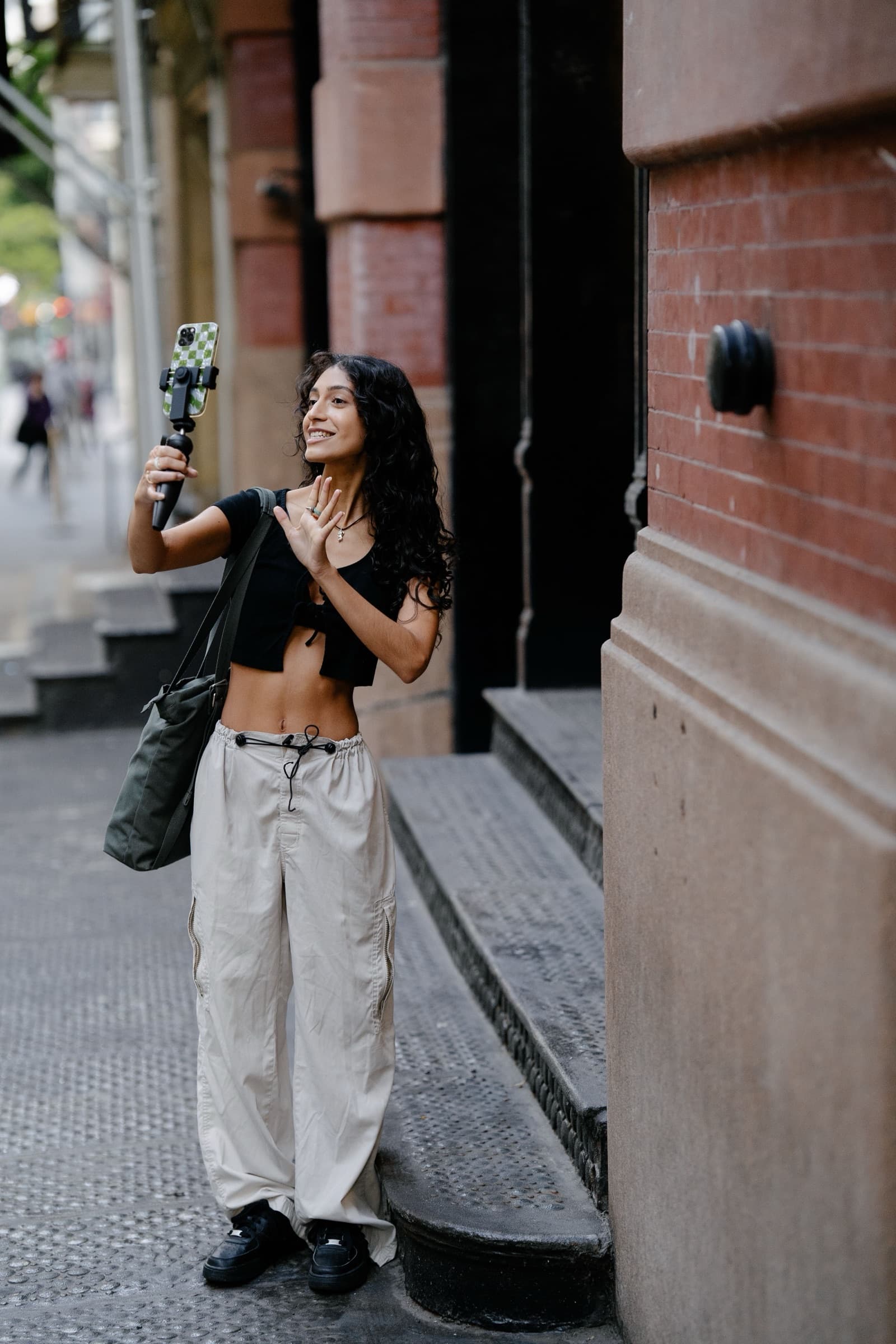 Creator filming a vlog on a city street